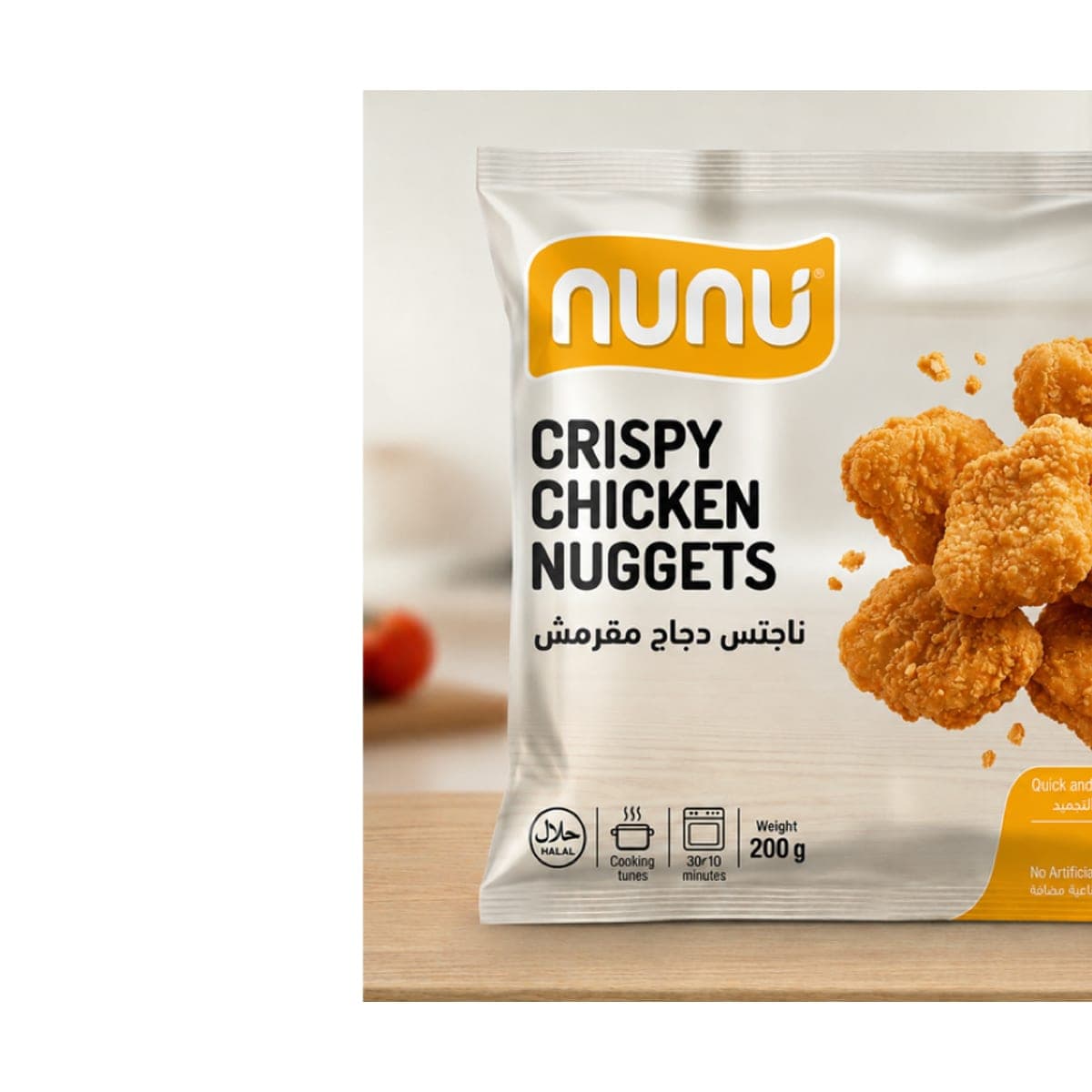A Nunu freezer bag of bite-size breaded chicken nuggets standing on a kitchen counter, shot from the front.